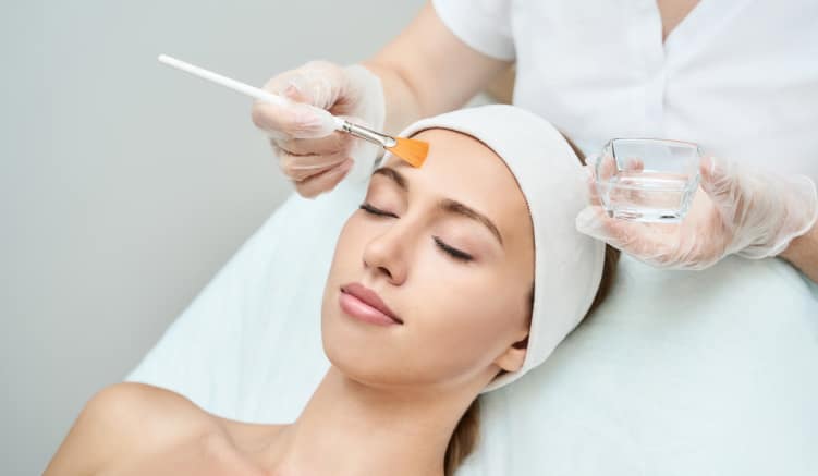 Chemical peel treatment in progress.